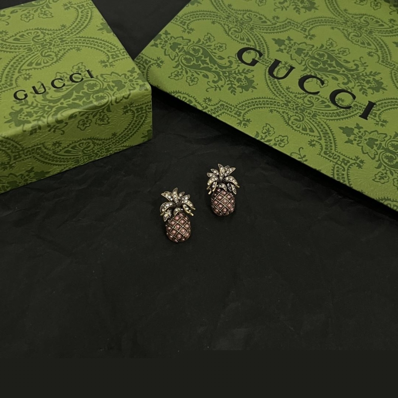 G*u*i earrings
